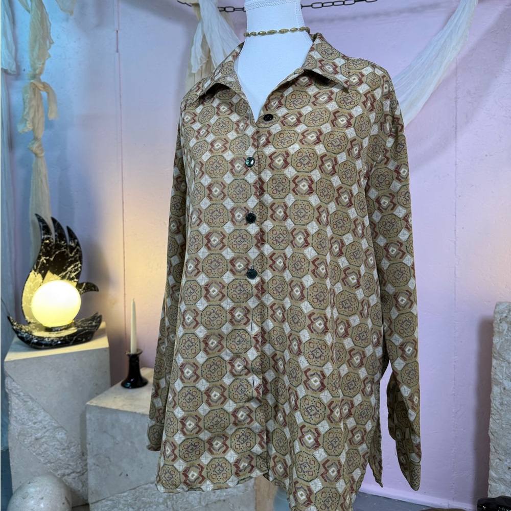 vintage patterned blouse featuring warm earthy tones and a geometric boho print